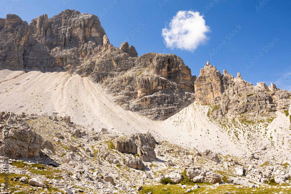Paternkofel mountain in Italian Dolomites against blue sky with rare clouds. Bright summer day in highlands