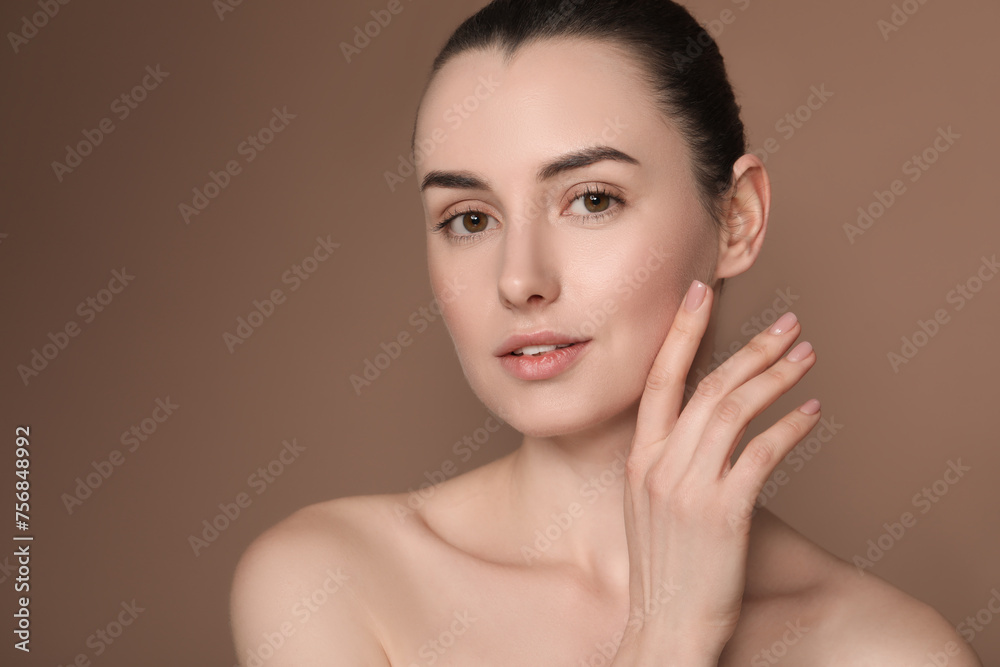 Portrait of beautiful young woman on brown background. Space for text Portrait of beautiful young woman on brown background. Space for text