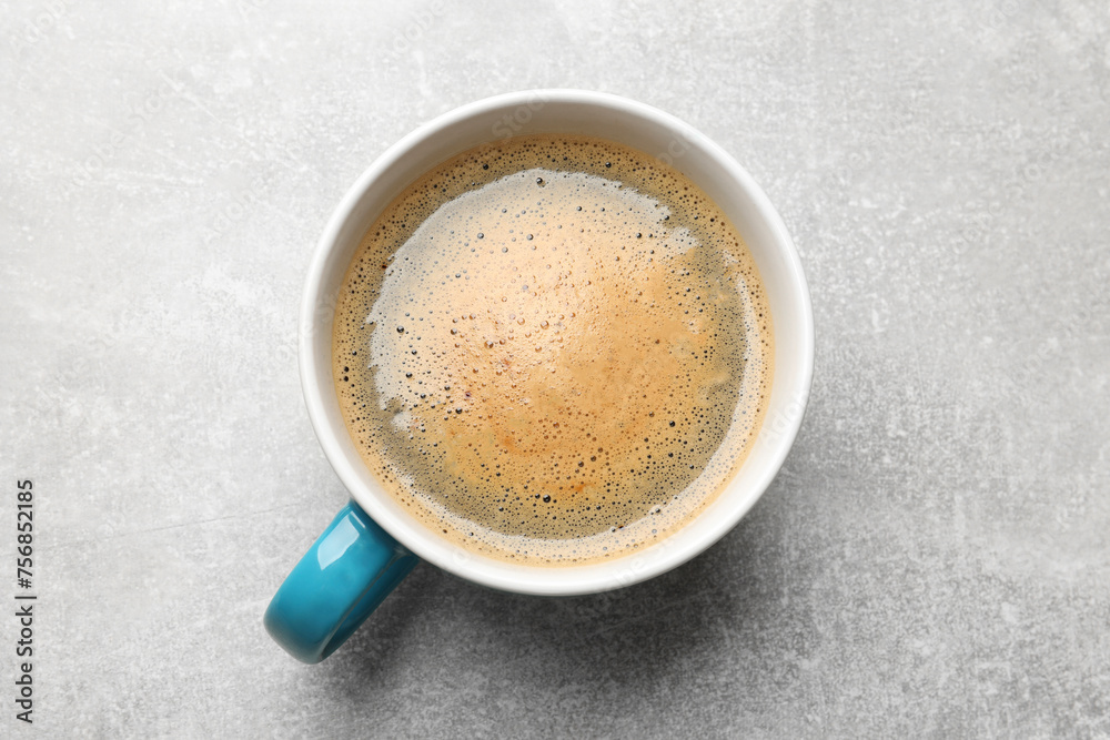 Cup of aromatic coffee on light grey table, top view Cup of aromatic coffee on light grey table, top view