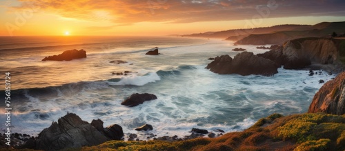 A serene dusk with water crashing against the rocky coastline under a colorful sky, creating a stunning natural landscape with peaceful waves and a calm horizon