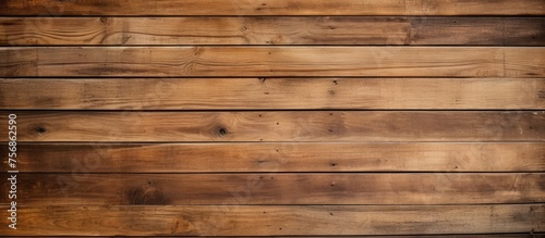 Closeup of a brown hardwood plank wall with a blurred background  showcasing the beautiful wood grain pattern and rectangular shape