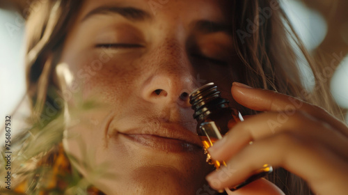 A closeup of a womans face in deep concentration is captured in the sixth image. She is holding a small bottle of fragrant essential oils and inhaling its calming scent which