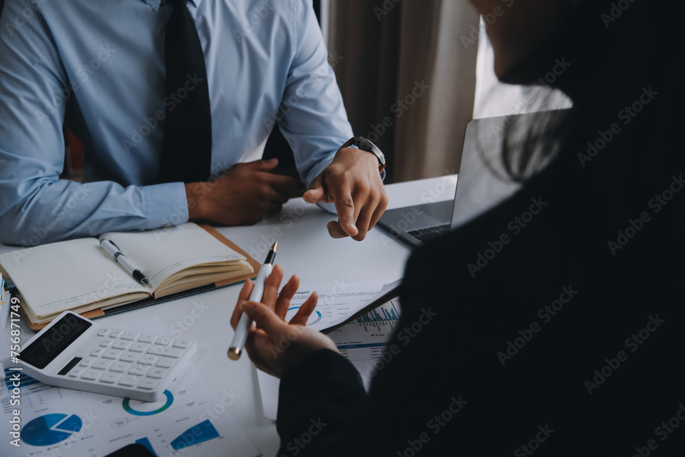 Fototapeta premium Business team working with new startup project plan and discussion information for financial strategy with laptop and digital tablet in a modern business lounge.