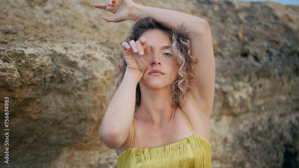 Portrait modern dancer moving hands in sensual performance on nature. Curly girl Portrait modern dancer moving hands in sensual performance on nature. Curly girl