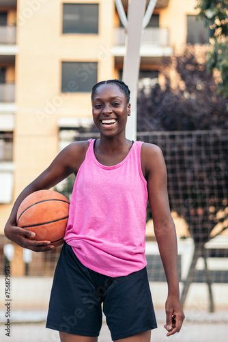 Portrait of Female Basketball Player Holding Ball