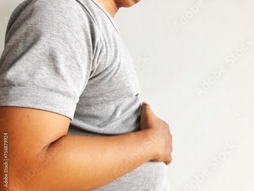 man holding stomach in pain