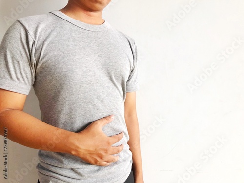 man holding stomach in pain