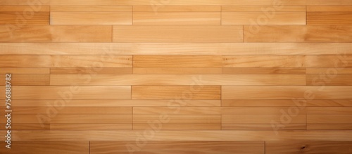A closeup shot of a polished brown wooden floor showcasing the natural grain of the wood with hints of varnish and amber tones © TheWaterMeloonProjec