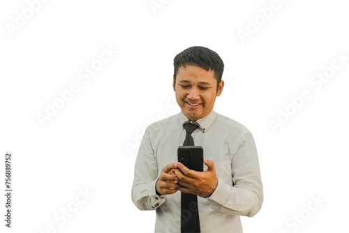Adult Asian man showing serious face expression when typing message on his mobile phone photo