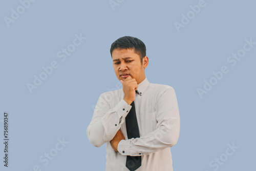 Adult Asian man showing thinking  face expression when looking to bottom camera photo