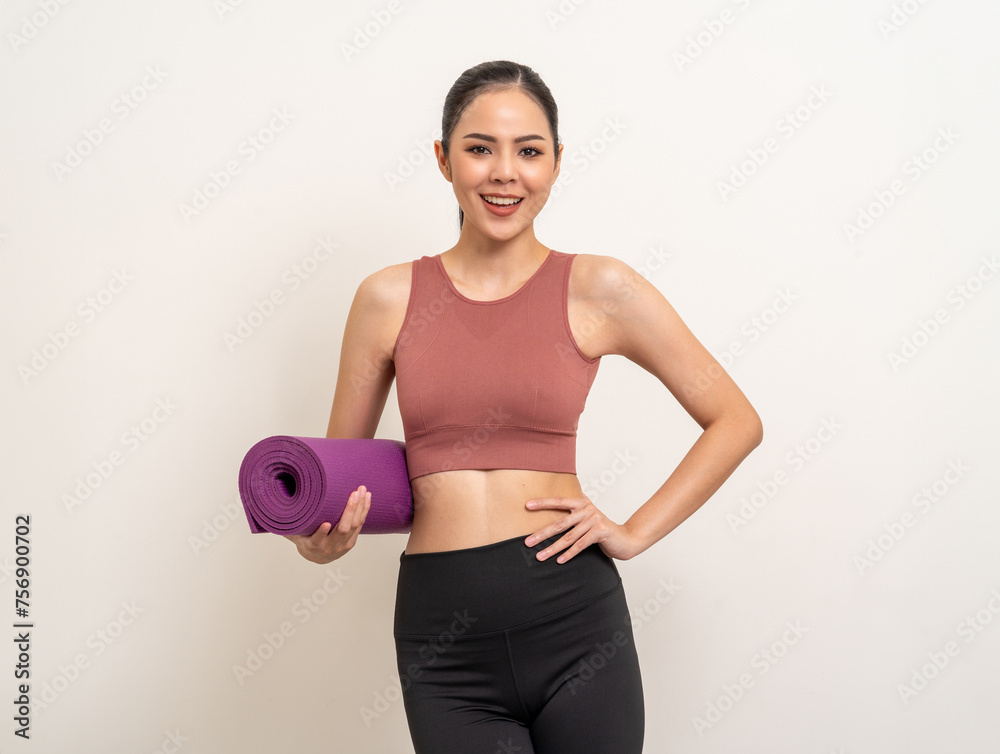 Young beautiful asian woman with sportswear holding yoga mat on isolated white background. Portrait attractive sporty woman standing pose exercise workout in studio. Training yoga lifestyle. Young beautiful asian woman with sportswear holding yoga mat on isolated white background. Portrait attractive sporty woman standing pose exercise workout in studio. Training yoga lifestyle.