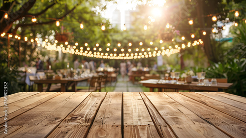 Empty Wooden Table with Party in Garden Background, Outdoor Celebration Setup on Wooden Table, Generative AI

 photo