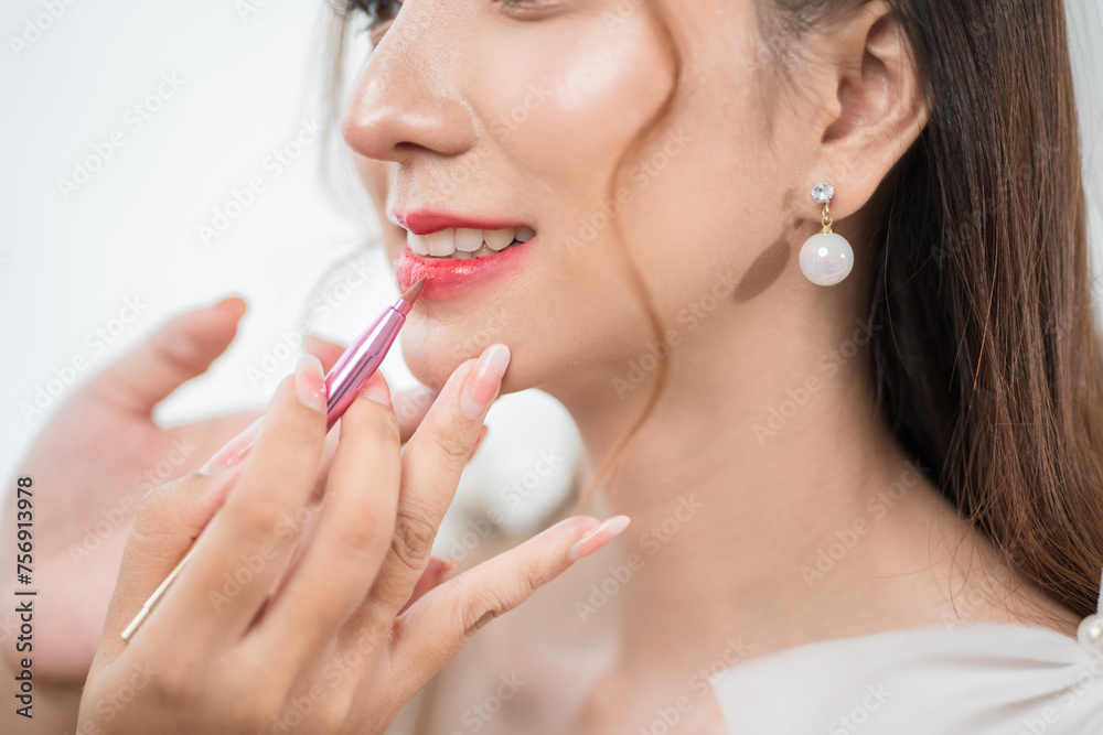 Beautiful young asian bride with wedding makeup and hairstyle before ceremony. Preparation for wedding applying with cosmetic by artist makeup. Beautiful young asian bride with wedding makeup and hairstyle before ceremony. Preparation for wedding applying with cosmetic by artist makeup.
