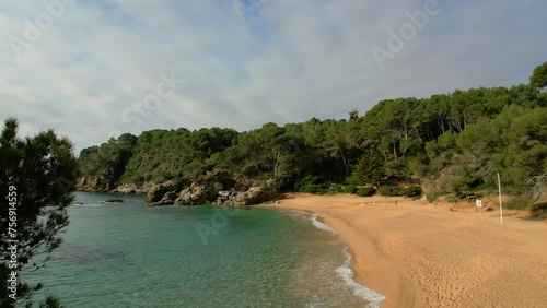 Delight in Lloret De Mar's aerial panoramas, revealing its pristine beaches and upscale tourist attractions such as Santa Cristina and Cala Treumal. photo