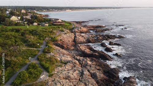drone above marginal way trail on the coastline of Ogunquit Maine USA tourist pedestrian walking and bicycling the coastline at sunset 