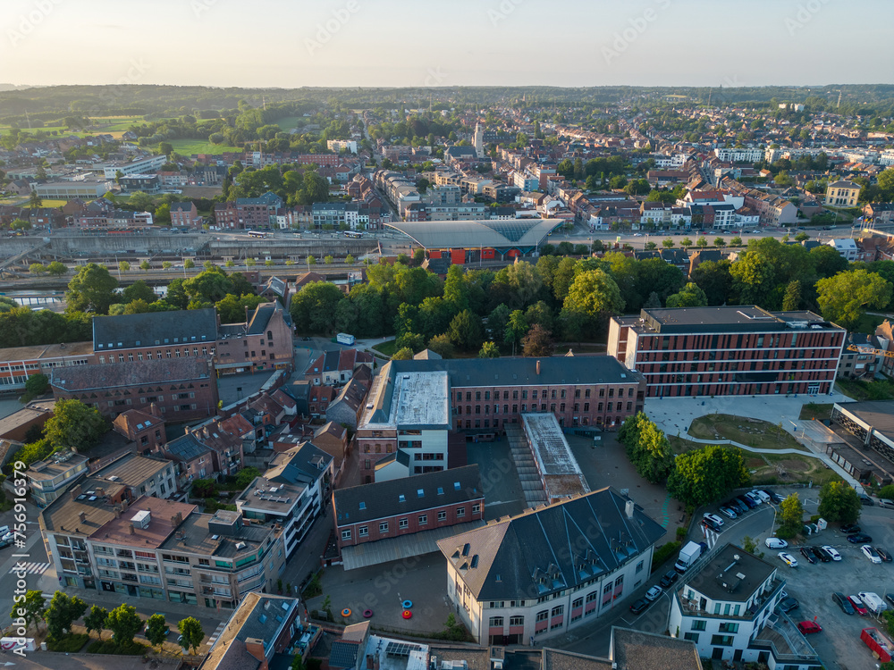 This aerial photograph showcases the heart of Halle, capturing the city's dynamic growth and architectural diversity. The foreground features a blend of modern and classic structures, demonstrating