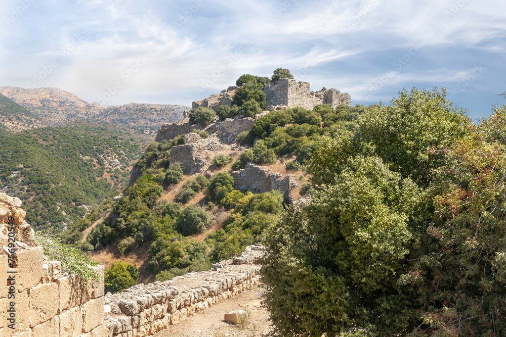View from fortress to far walls and towers of the ruins of the medieval fortress of Nimrod - Qalaat al-Subeiba, located near the border with Syria and Lebanon on the Golan Heights, in northern Israel