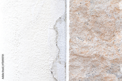 Cracked concrete wall. Uneven stucco surface backdrop. Unfinished work construction. 