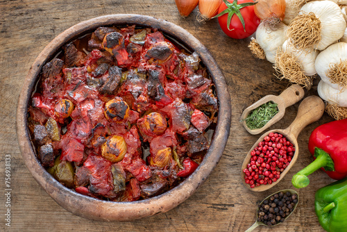 Casserole kebab named belen tava or sac saç kebabı . Roasted meat with pepper and tomato. 