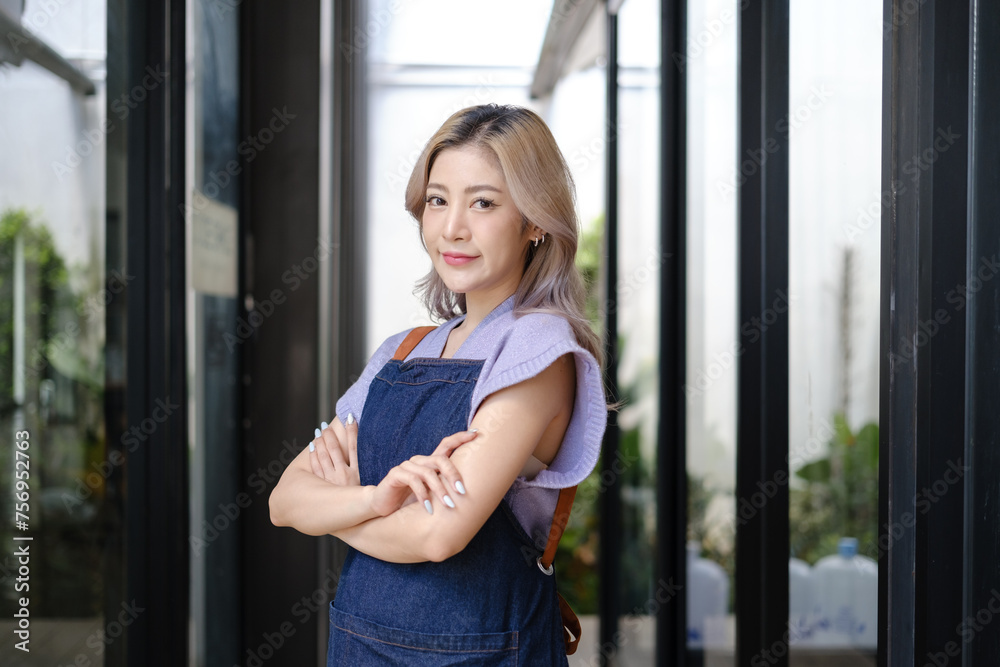 Startup successful small business owner sme beauty girl stand with tablet smartphone in coffee shop restaurant. Portrait of asian tan woman barista cafe owner. SME entrepreneur seller business concept Startup successful small business owner sme beauty girl stand with tablet smartphone in coffee shop restaurant. Portrait of asian tan woman barista cafe owner. SME entrepreneur seller business concept