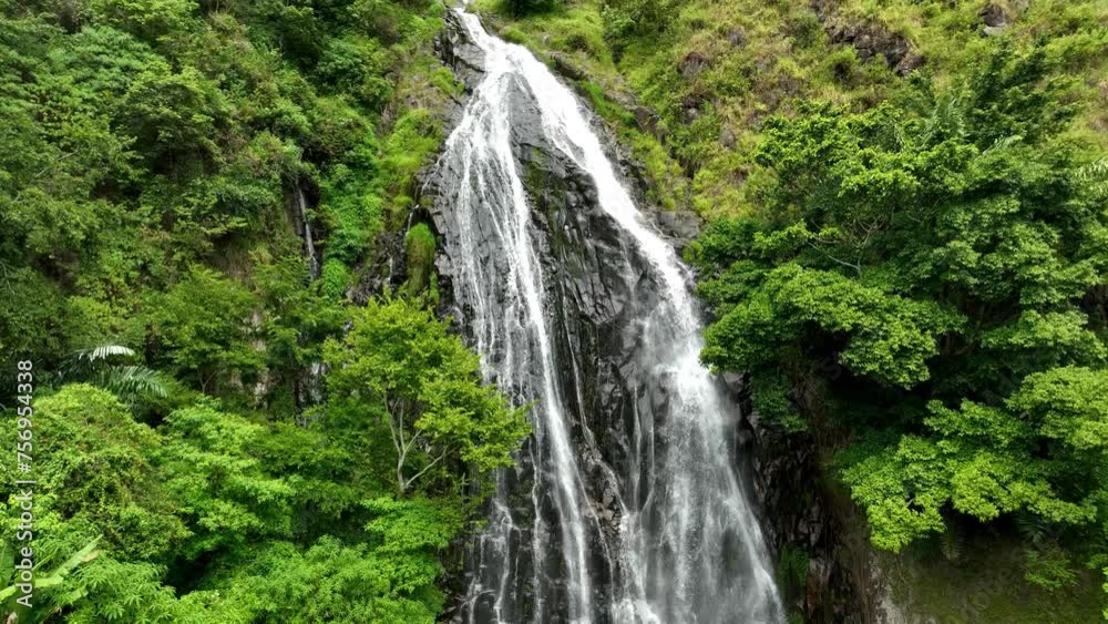 Water flows over rocky terrain creating picturesque natural scenery Water flows over rocky terrain creating picturesque natural scenery