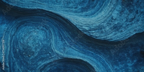 rock with blue variants stone texture full of curves and smooth photo