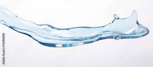 A closeup of a water splash on a white background. The liquid appears electric blue against the transparent material, resembling a windshield on an automotive exterior