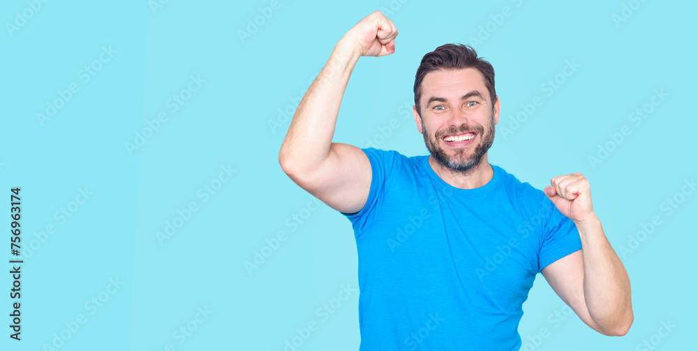 The winner. Successful man raising arms. Excited man with arms up celebrating success. Ecstatic excited male winner celebrating win. Overjoyed business man enjoy victory. The winner. Successful man raising arms. Excited man with arms up celebrating success. Ecstatic excited male winner celebrating win. Overjoyed business man enjoy victory.