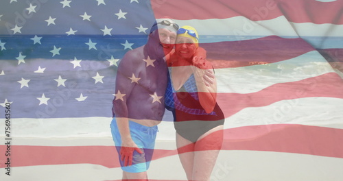 Image of flag of usa over caucasian senior couple on beach in summer