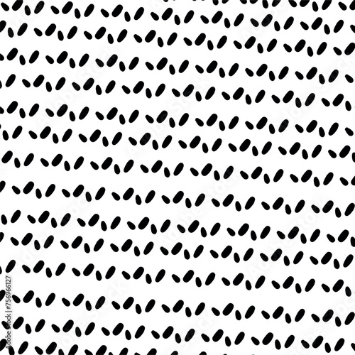 A cluster of small and oblong spots looking in different directions.