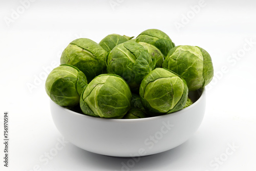 Fresh Brussels sprouts isolated on white background.