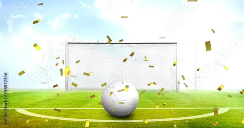 Image of confetti and football over stadium