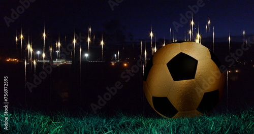 Image of glowing lights at nights sky over football ball