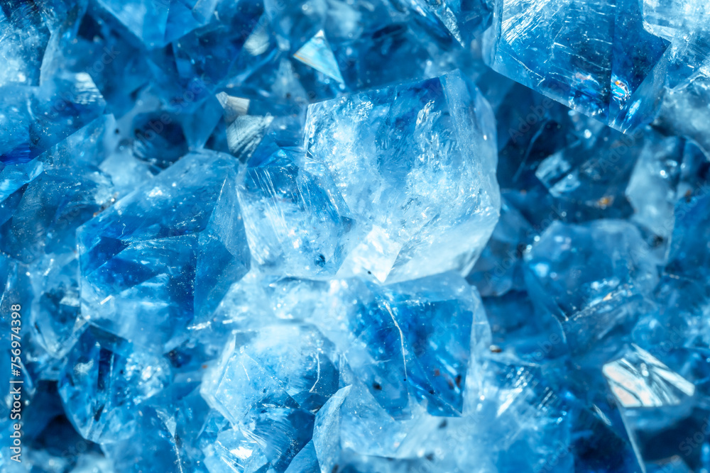 Blue Crystal Mineral Stone. Gems. Mineral crystals in the natural environment. Texture of precious and semiprecious stones. Seamless background with copy space colored shiny surface of precious stones