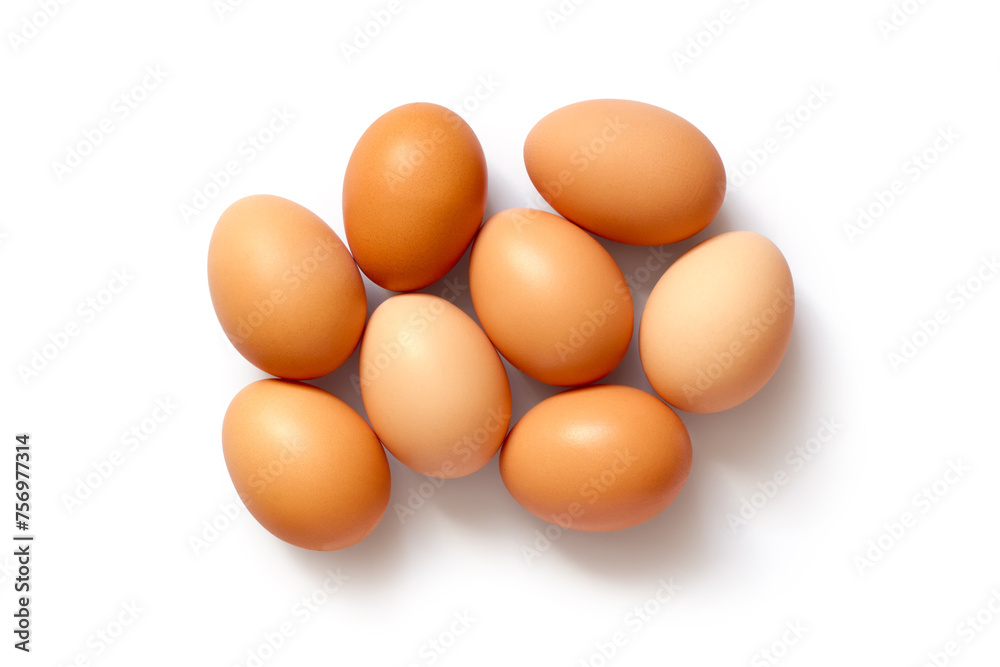 Natural homemade chicken eggs. Several eggs on a white background. Top view. With a shadow. Natural homemade chicken eggs. Several eggs on a white background. Top view. With a shadow.