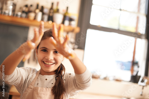 Girl, portrait and hands for baking in kitchen, pastry and happy for food preparation in home. Female person, kid and smile for learning in home, child development and education for skills or cake