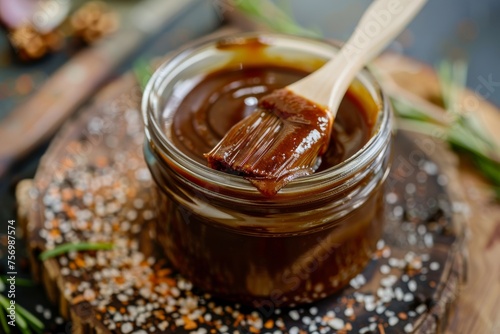 BBQ sauce in jar with brush