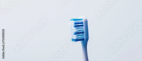 Blue and white toothbrush with white background