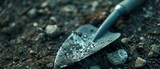 Close up shot of a trowel in a garden