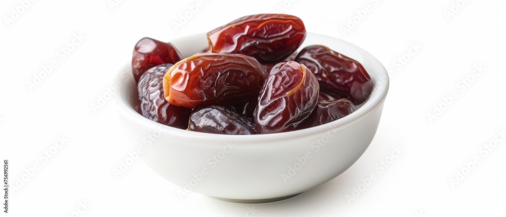 dried dates in a white bowl on white background