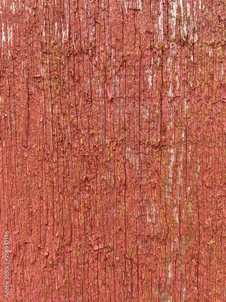 Fototapeta premium wooden background in red color with cracks