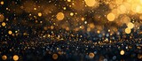 Shiny gold and black sparkles background for celebrations with copy space
