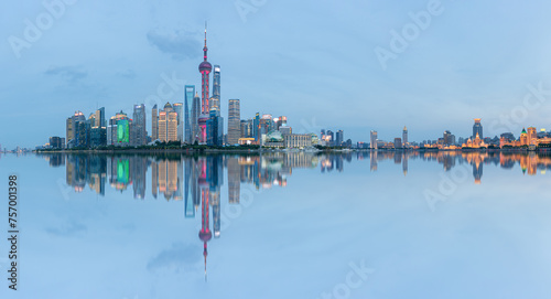 Panoramic skyline of Shanghai and Huangpu river at night © shengyi