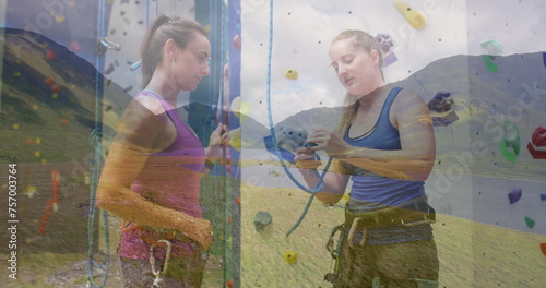 Image of landscape over caucasian women by climbing wall