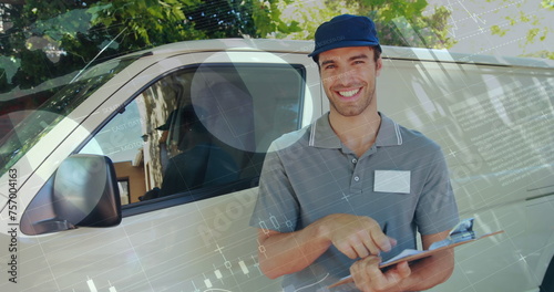 Front view of a deliveryman beside a van writing on a clipboard smiles and signals a thumbs up