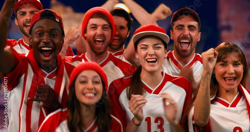 Photography Front view of enthusiastic sports fans wearing red and white jerseys cheering