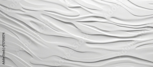 A detailed closeup of a white linen bed sheet with wave patterns, resembling the landscape. The texture gives off a serene vibe with tints and shades of silk and fur