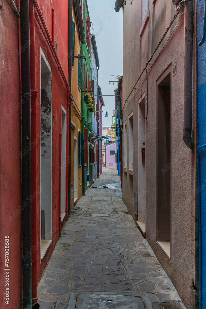 Fototapeta premium Burano colored houses during Winter time with fog background