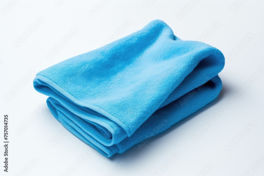 A white background with a blue towel A white background with a blue towel