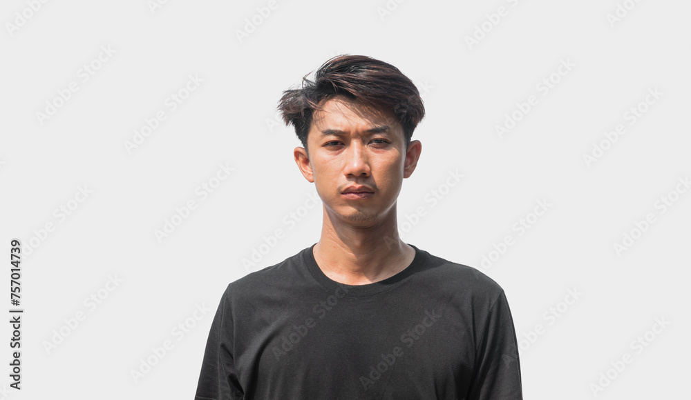 A young Asian man in his 20s wearing black t-shirt is depressed and worried in distress standing on a gray background. Crying in anger and fear. Sad expression concept A young Asian man in his 20s wearing black t-shirt is depressed and worried in distress standing on a gray background. Crying in anger and fear. Sad expression concept